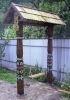 Качеля деревянная с резьбой и росписью в русской традиции для сада